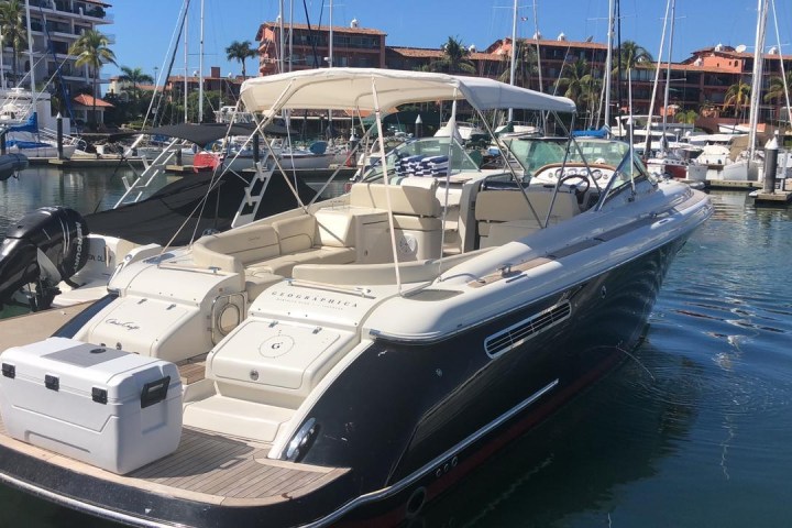 a boat is docked next to a body of water