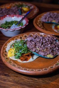 a plate of food on a wooden table