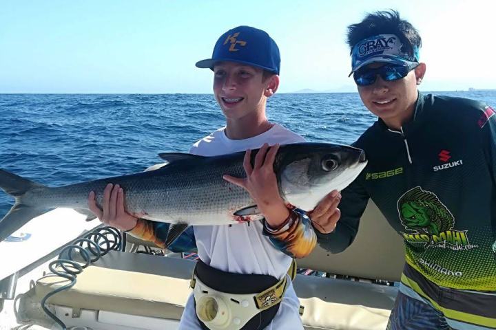 a group of people on a boat in the water