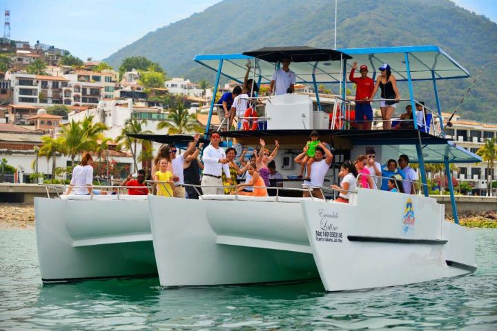 a group of people on a boat in the water