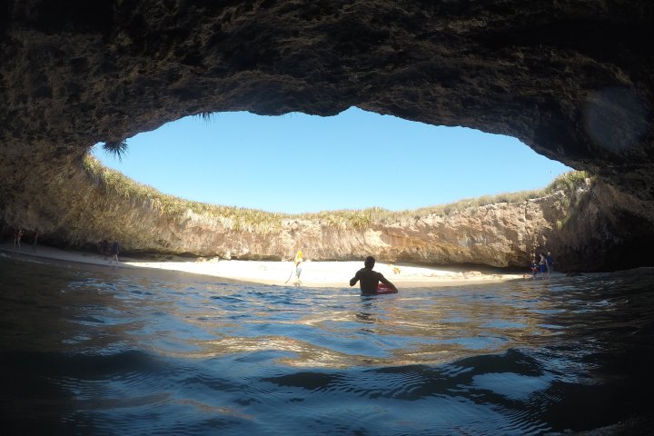 a man riding a horse in a body of water