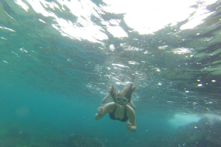 a person swimming in the water