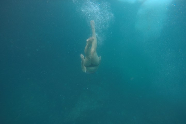 a person swimming in the water