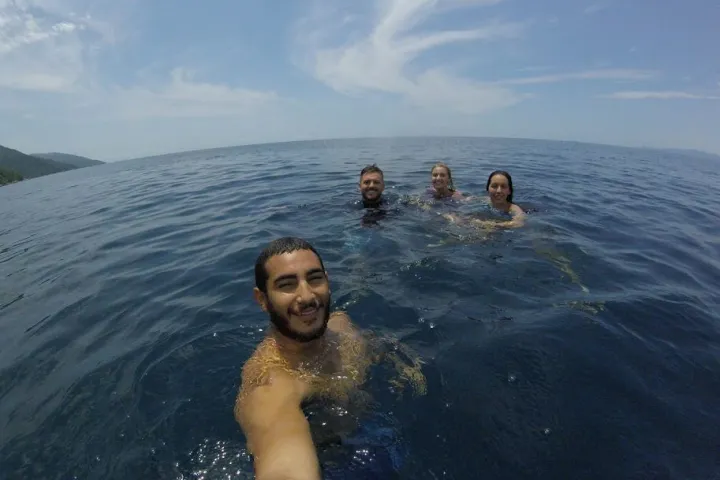 a man and woman swimming in the water