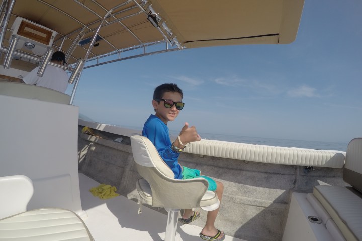 a young boy in a blue shirt