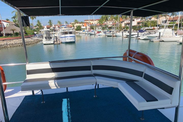 a boat that is sitting on a dock next to a body of water