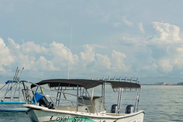 a small boat in a large body of water