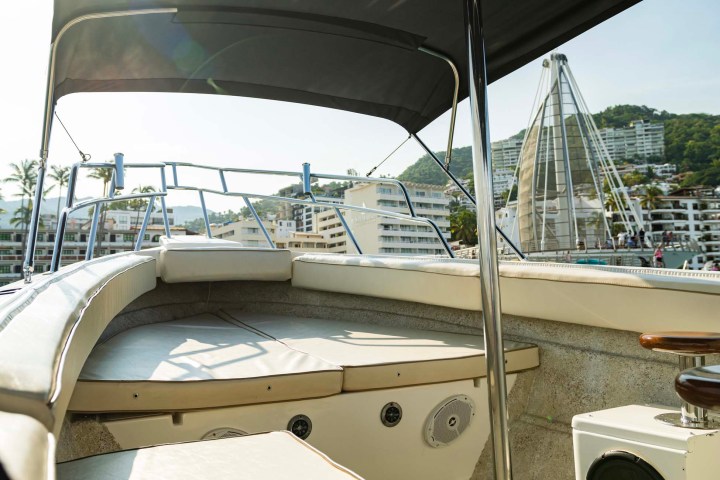 a boat sitting on top of a car
