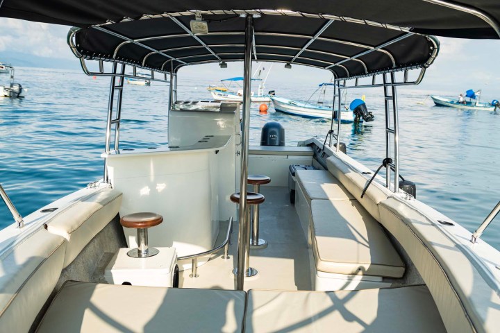 a boat is docked next to a body of water
