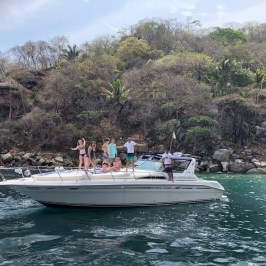 a group of people on a boat in the water