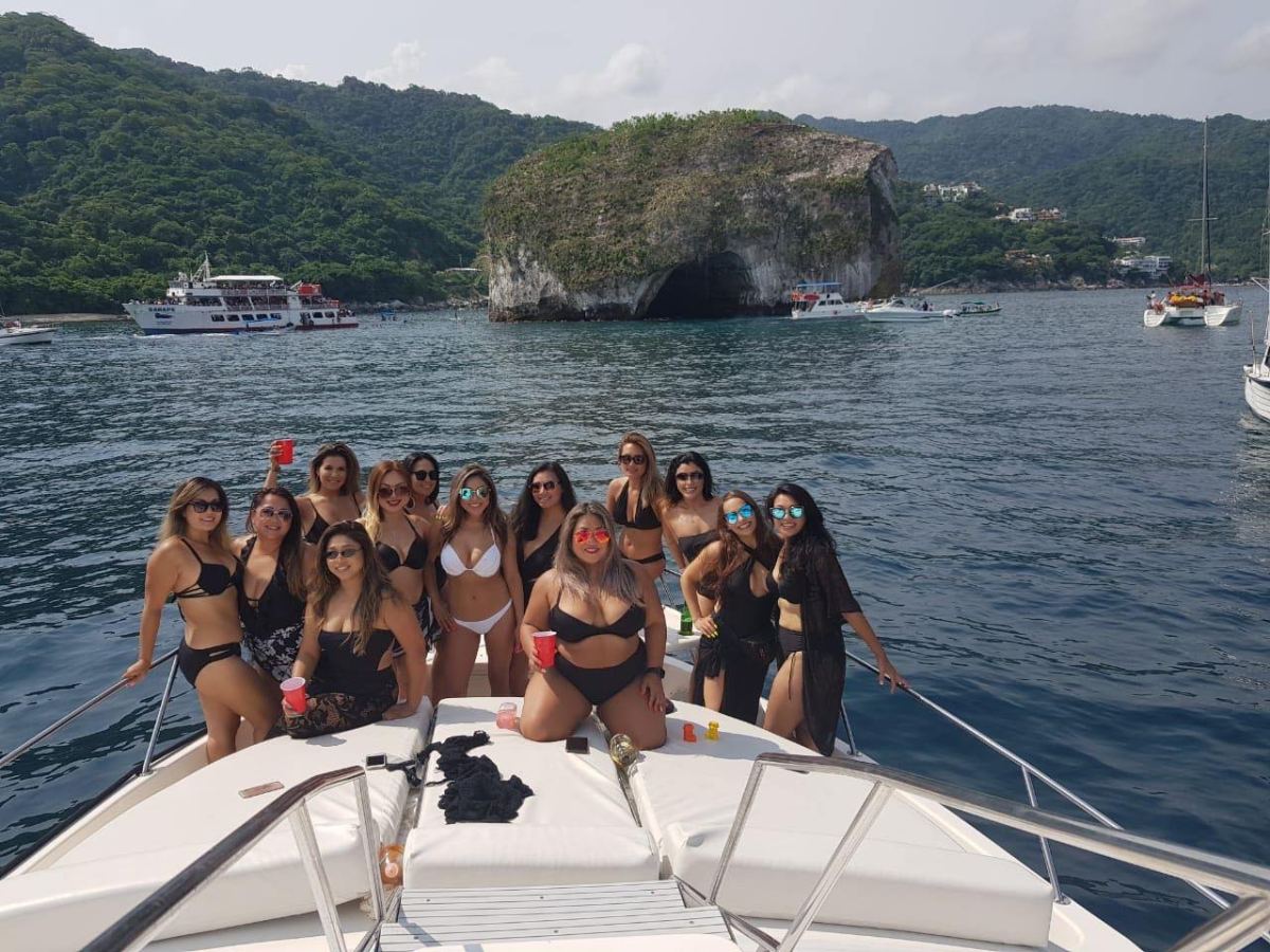 a group of people in a boat on a body of water