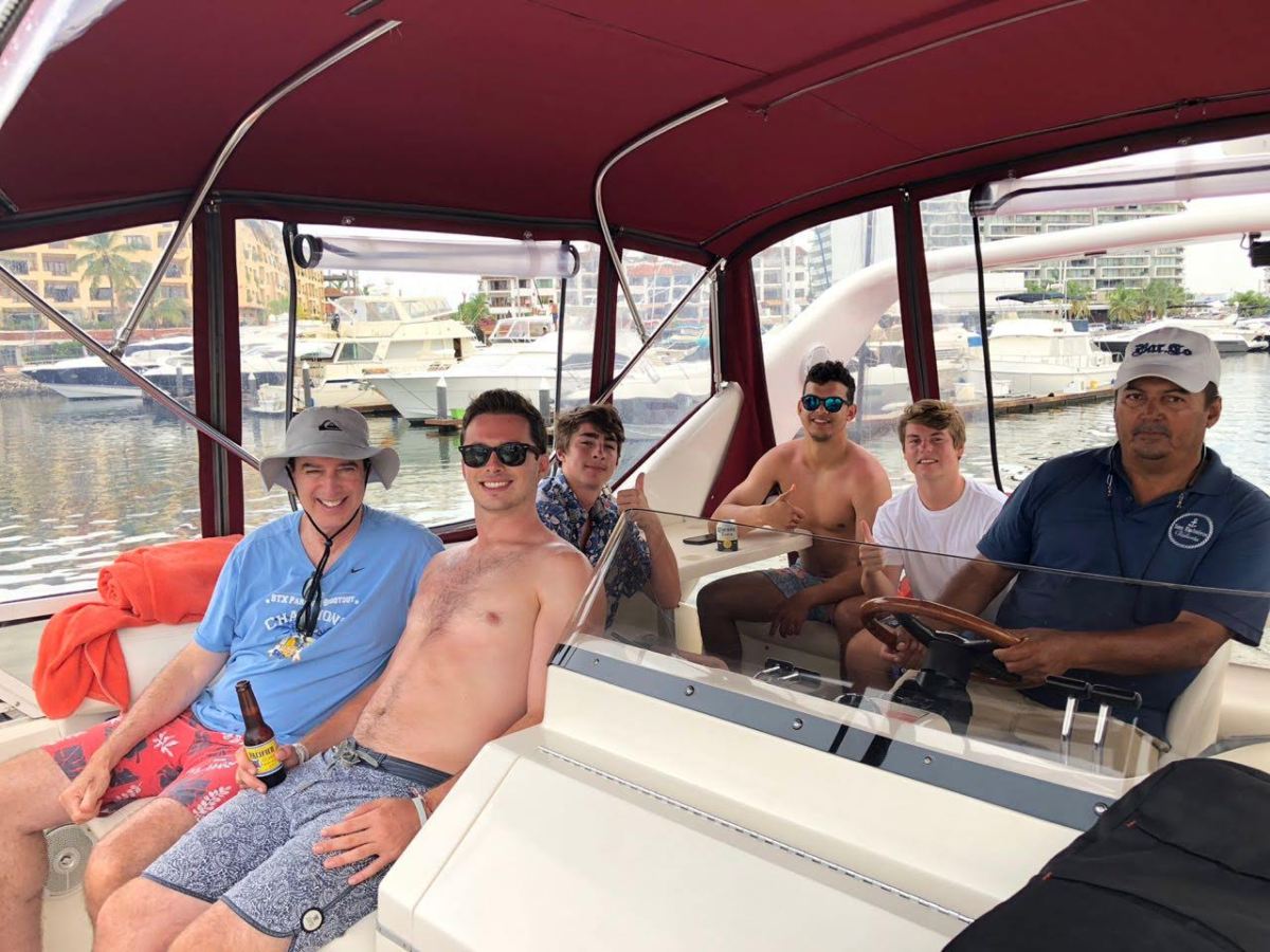 a group of people sitting on a boat