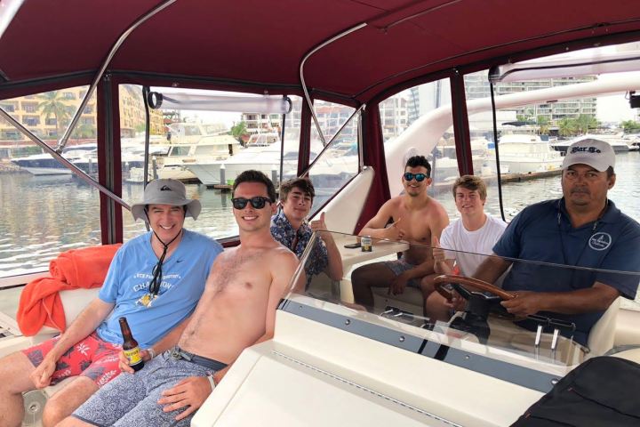 a group of people sitting on a boat