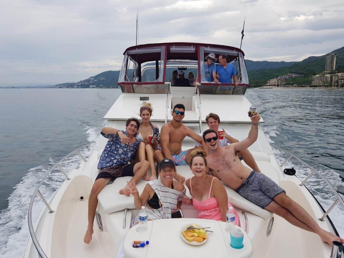 a group of people in a boat on a body of water