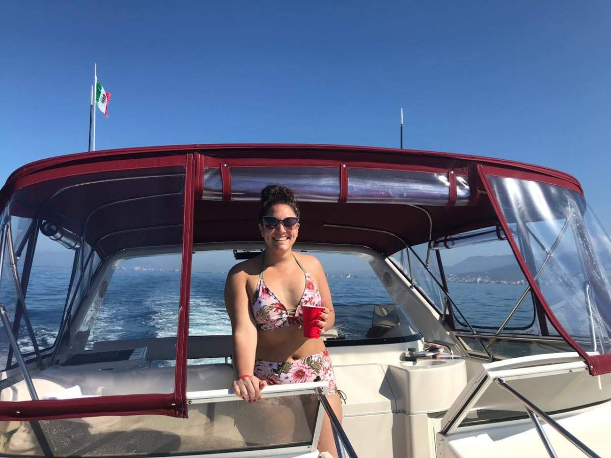 a person standing on a boat in the water