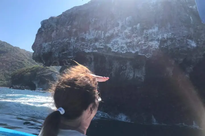 a person standing in front of a mountain