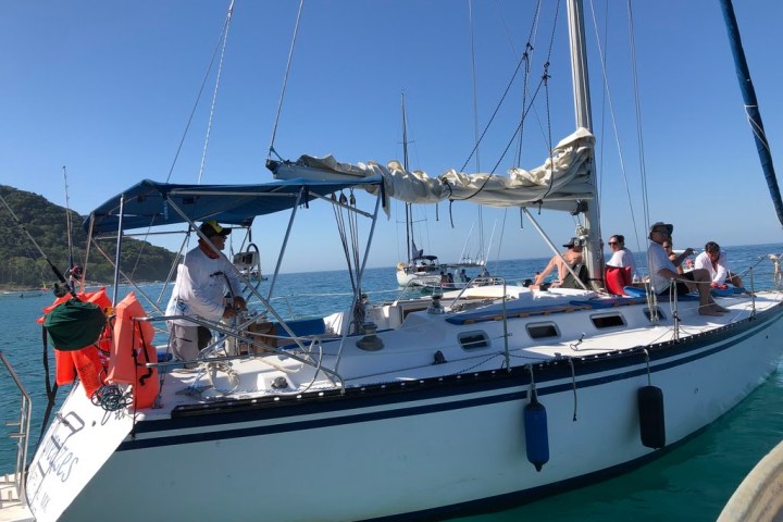 a boat is docked next to a body of water