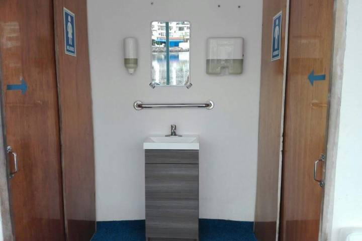 a white sink sitting next to a door