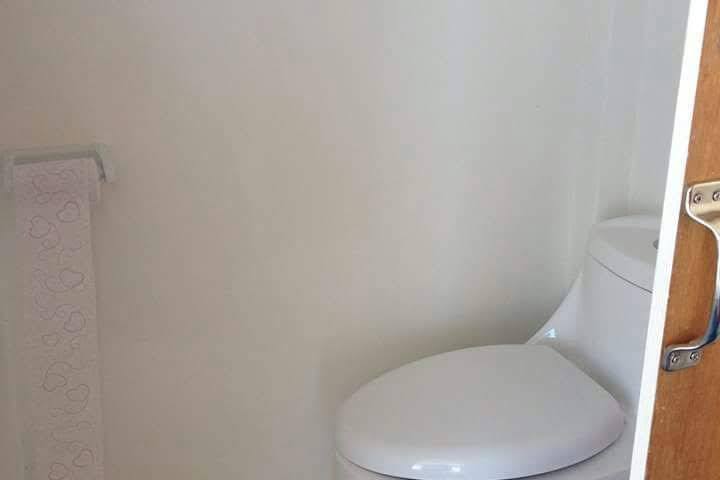 a white tub sitting next to a door