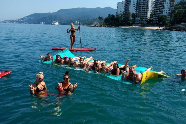 a group of people swimming in a body of water