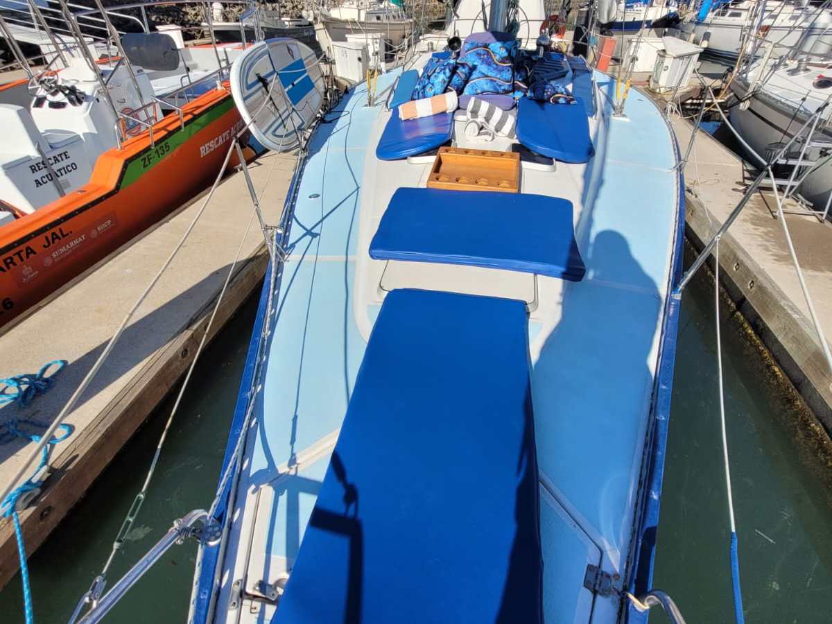 a boat is docked next to a body of water