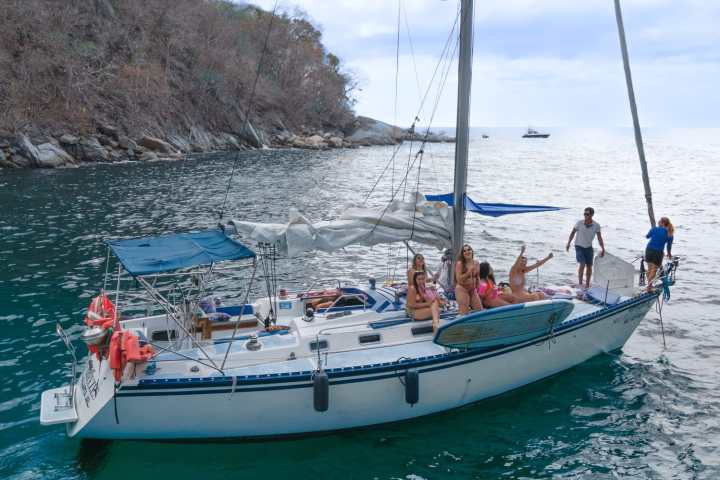 a group of people on a boat in the water