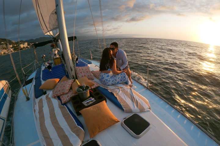 a person standing next to a body of water