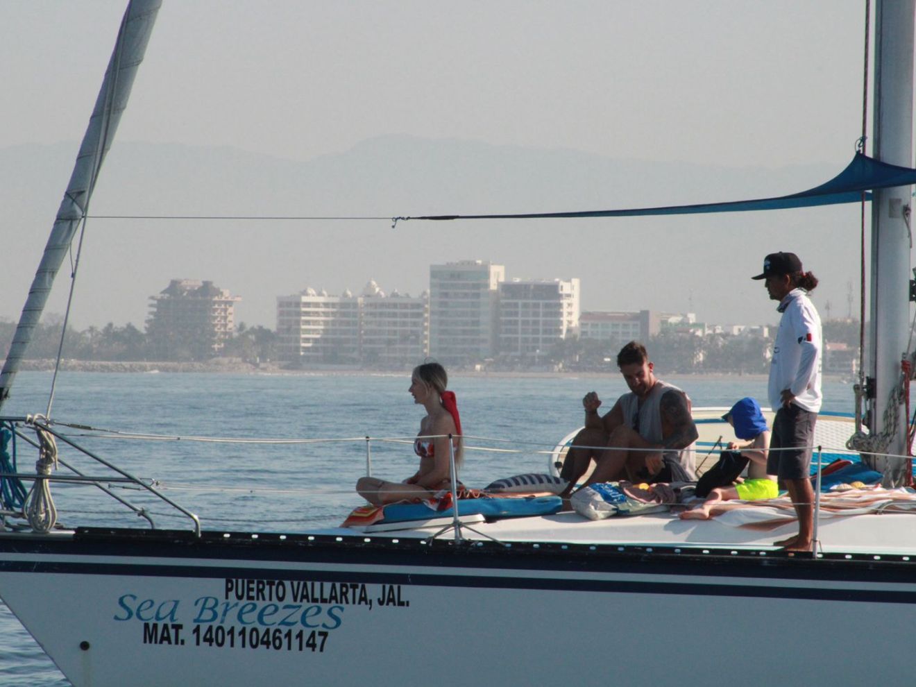 a group of people on a boat in the water