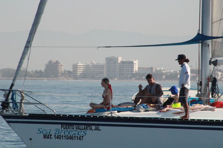 a group of people on a boat in the water