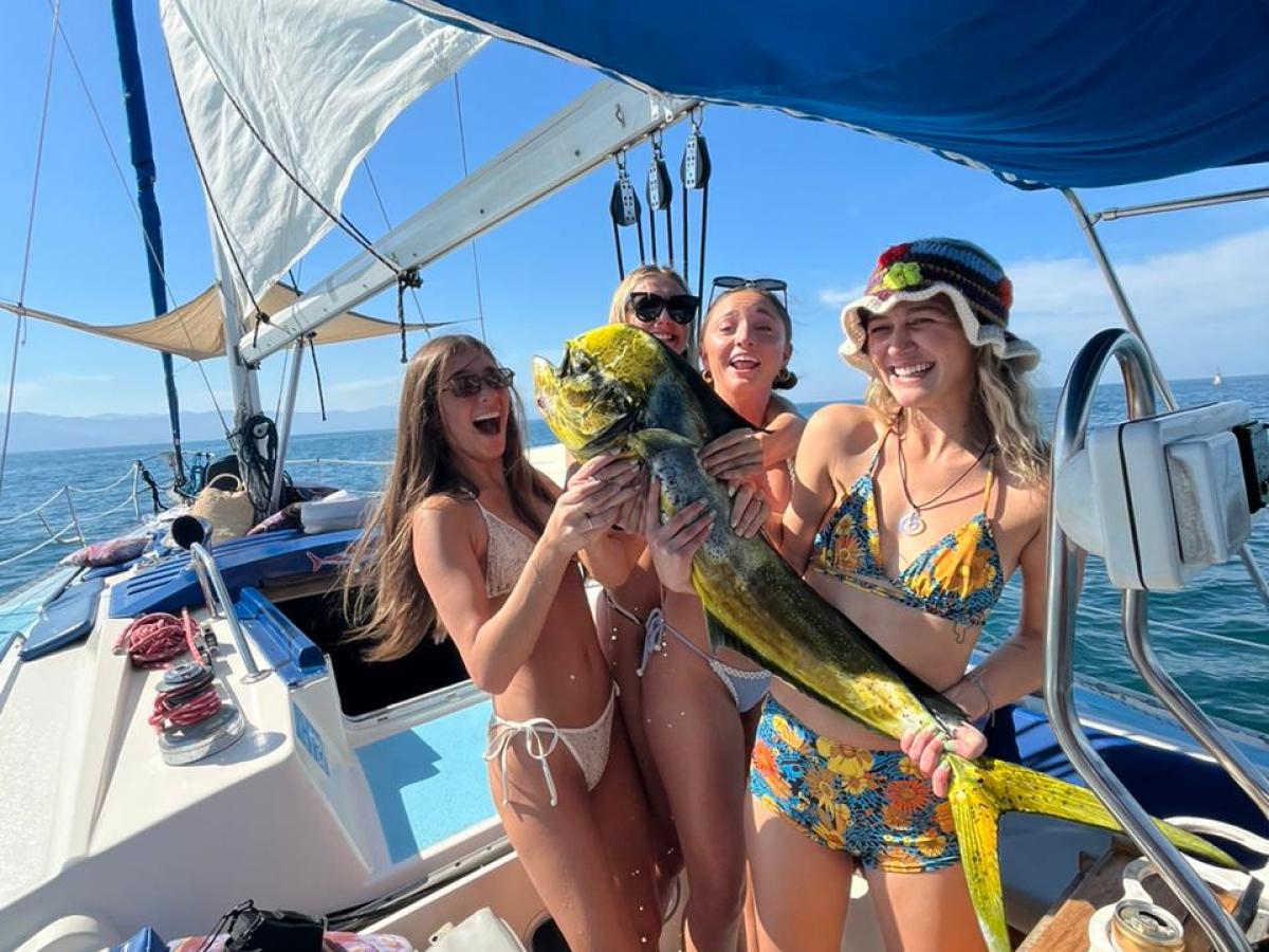 a person standing next to a boat