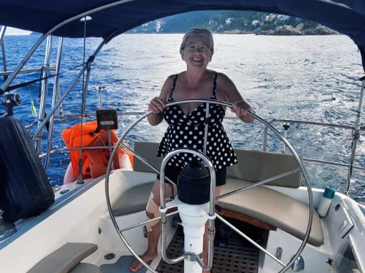 a person sitting on a boat in the water