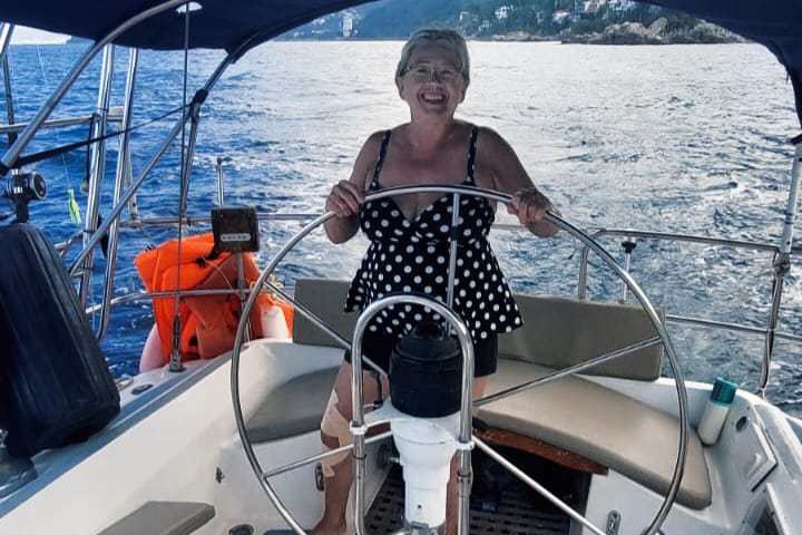 a person sitting on a boat in the water