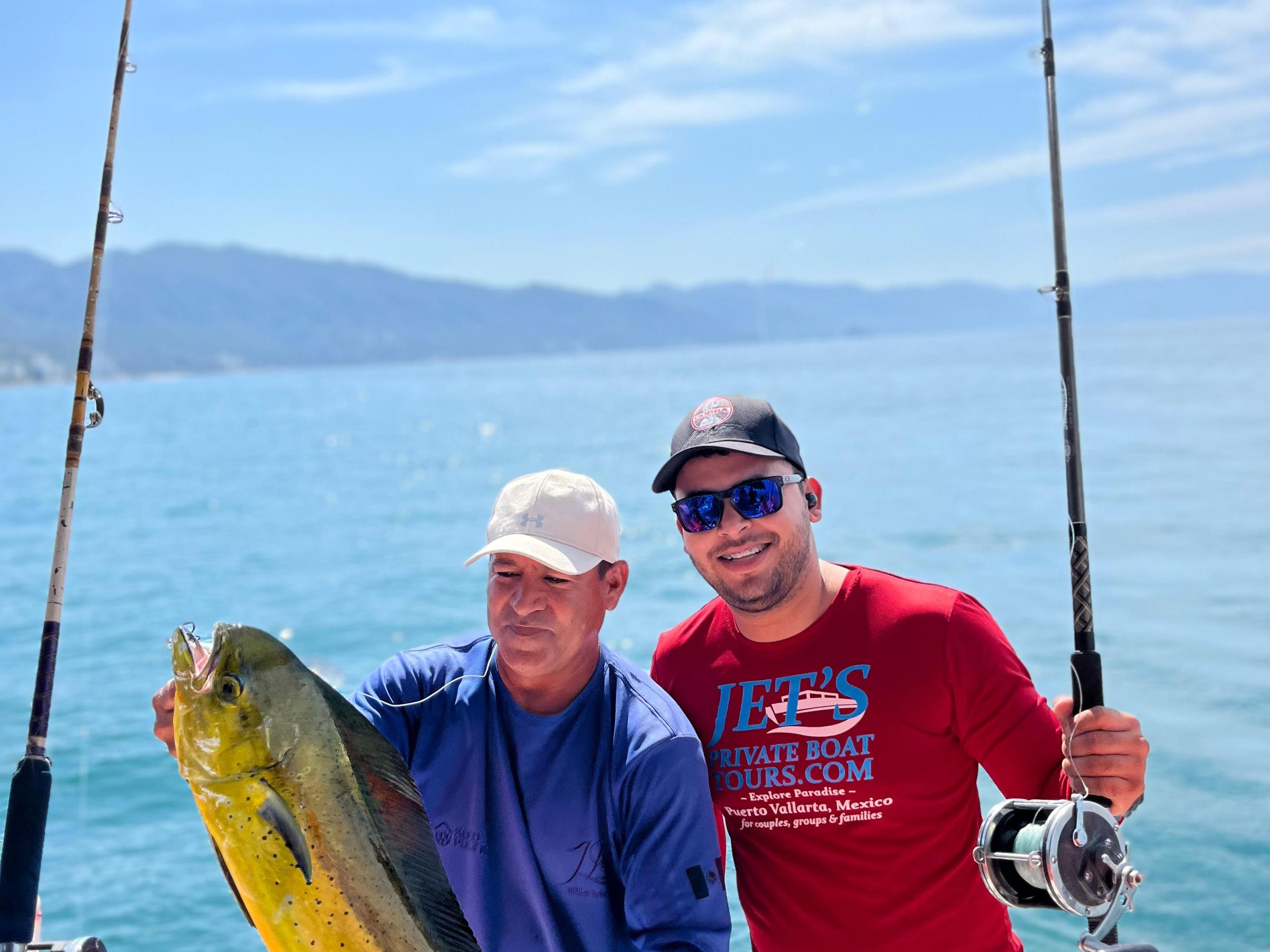 a man holding a fish in the water