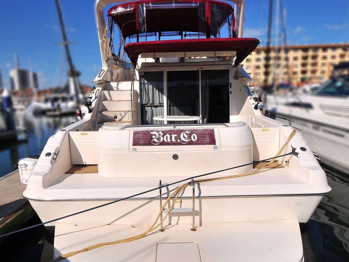 a large white cake sitting on top of a boat
