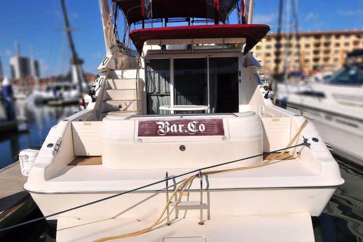 a large white cake sitting on top of a boat