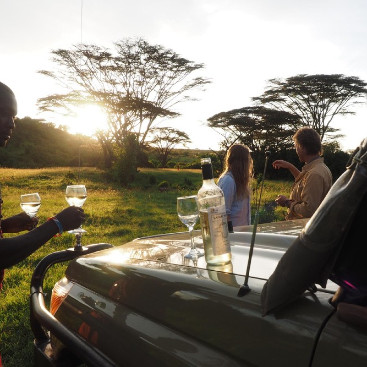 a person sitting in a chair talking on a cell phone