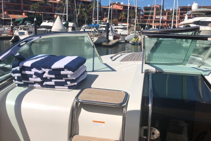 a boat sitting on top of a car