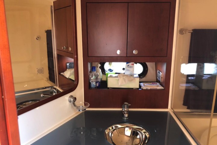 a kitchen with a sink and a mirror