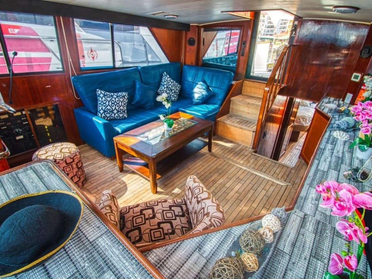 a room filled with furniture and vase of flowers on a table