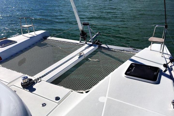 a boat that is sitting on a dock next to a body of water