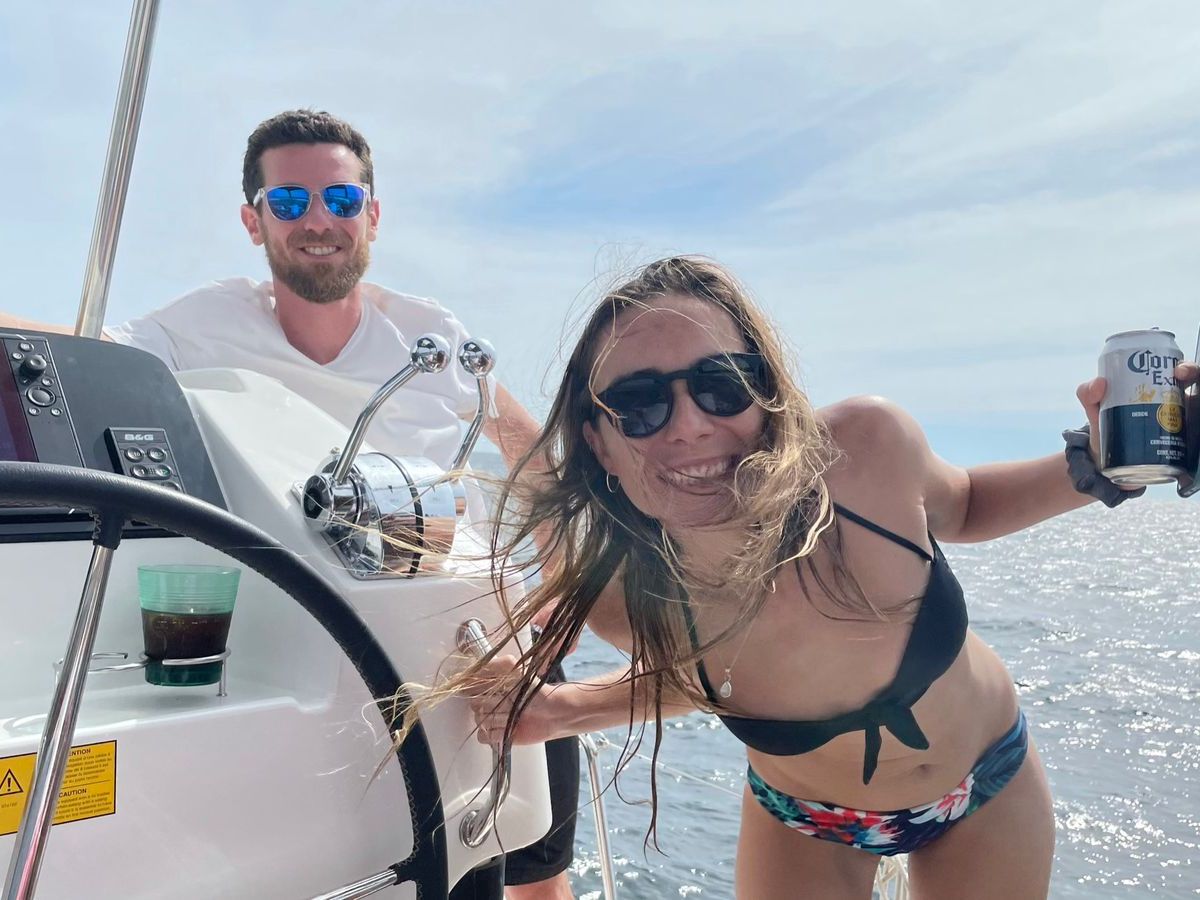a woman riding on the back of a boat
