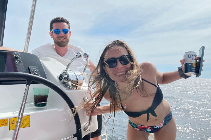 a woman riding on the back of a boat