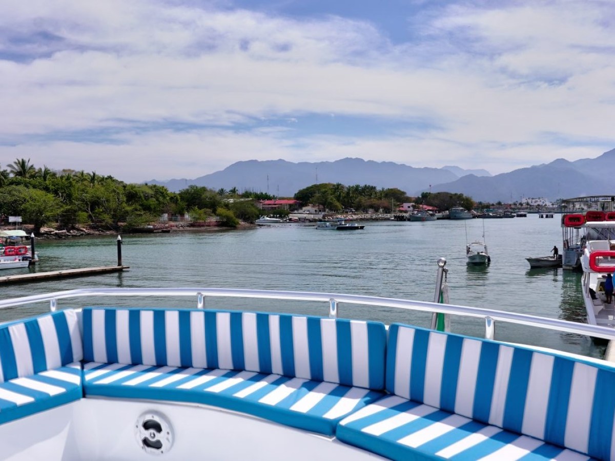 a boat is docked next to a body of water