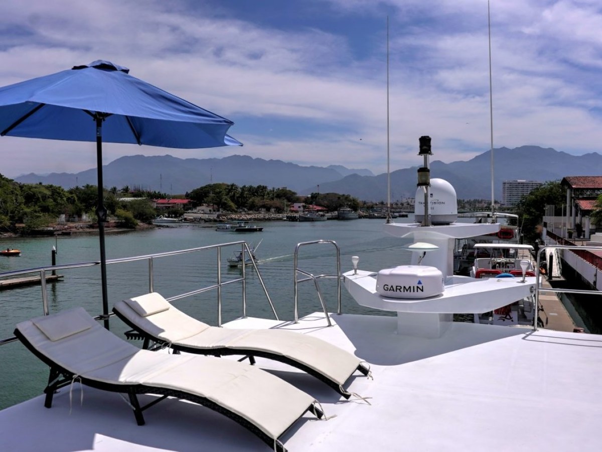 a boat is docked next to a body of water