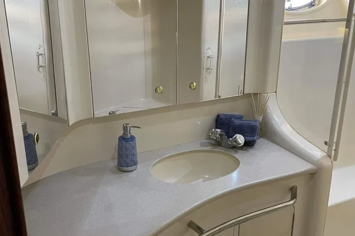 a room with a sink and a mirror