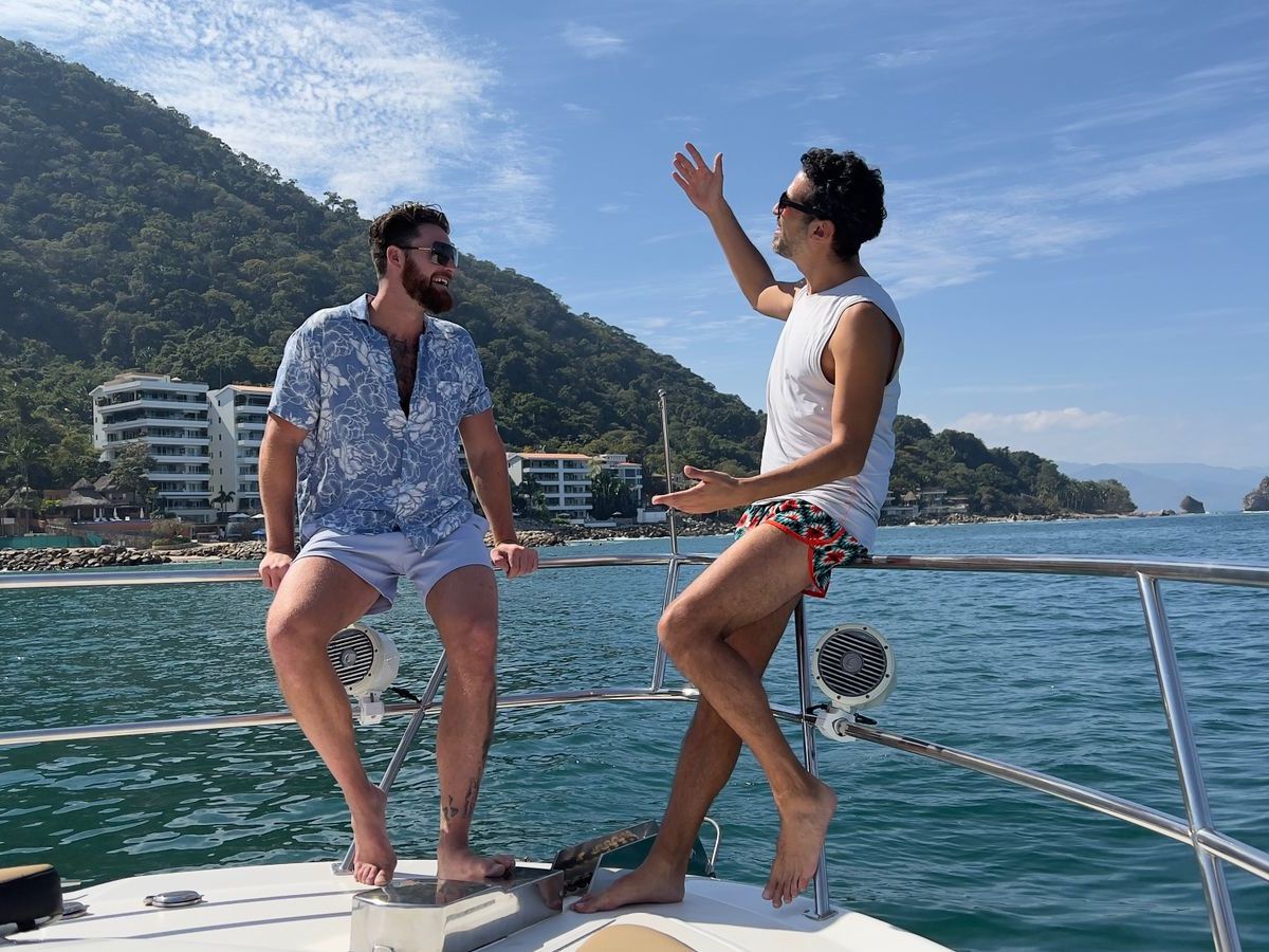 a person standing next to a body of water