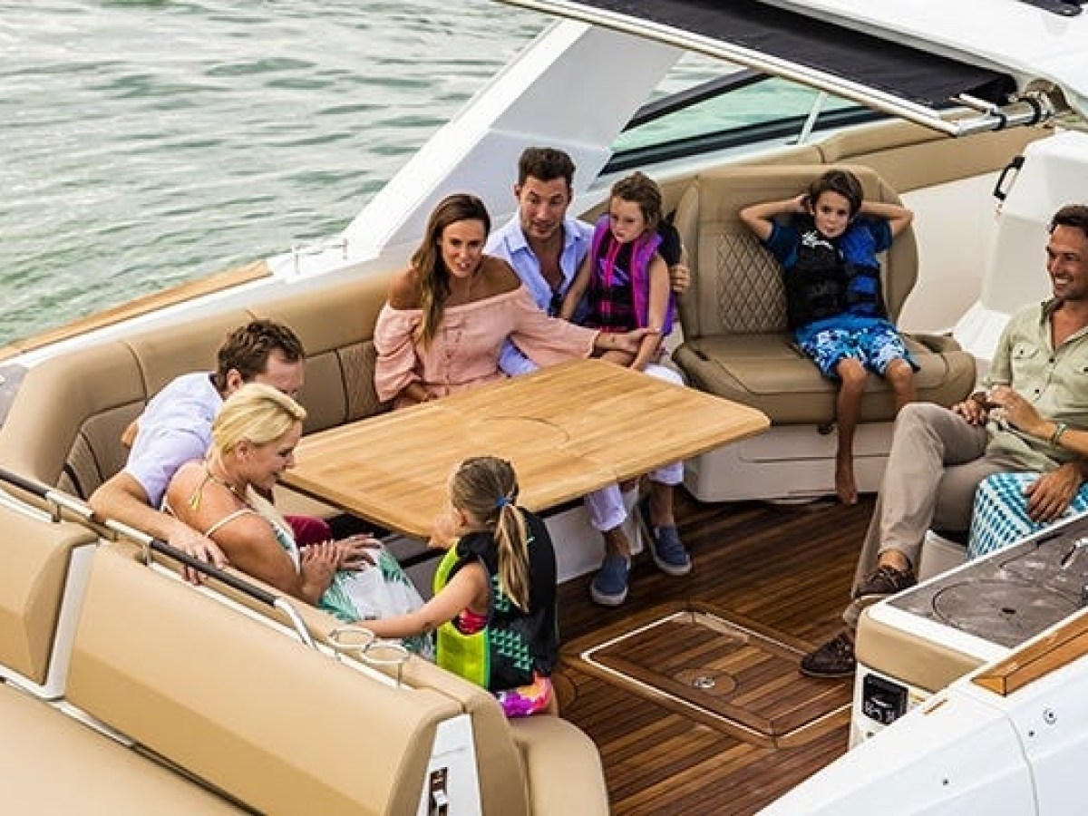 a group of people sitting on a boat