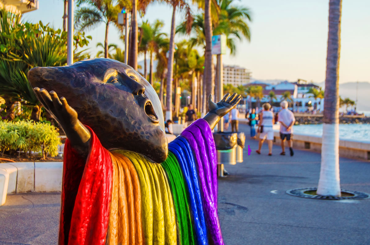 Vallarta pride a person holding a colorful umbrella