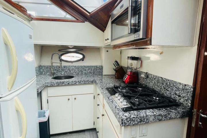 a kitchen with a stove top oven sitting inside of a building