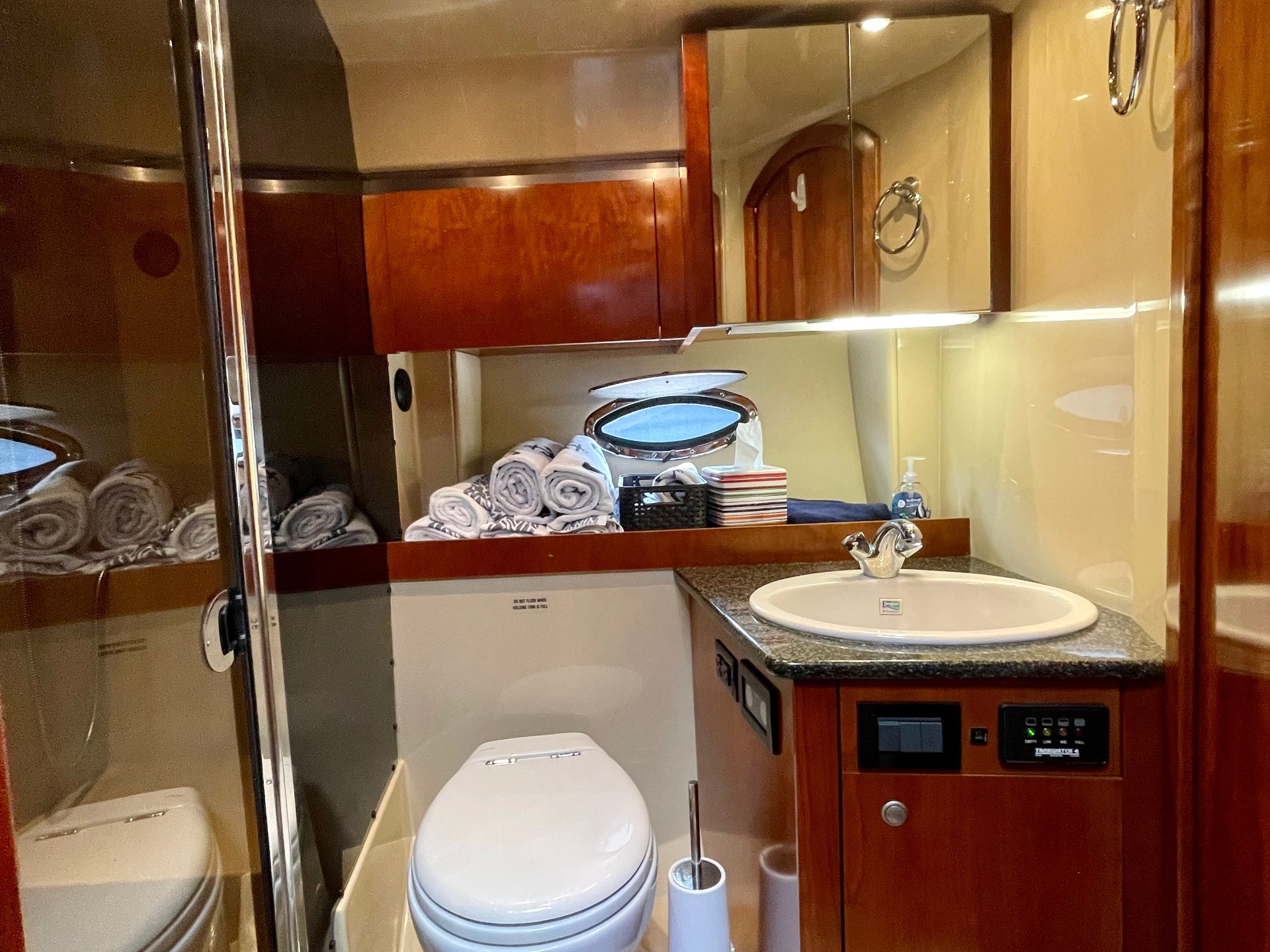 a kitchen with a sink and a mirror